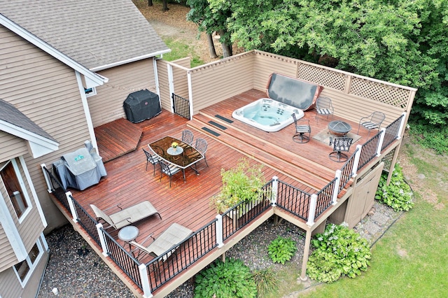 wooden terrace with an outdoor hot tub