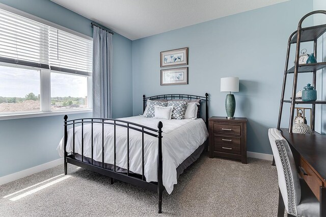 bedroom with light colored carpet