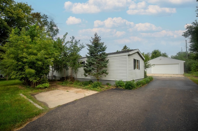 view of front of house with an outdoor structure and a garage