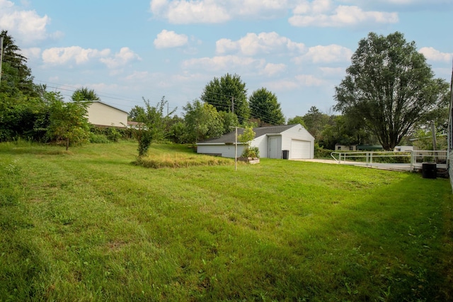 view of yard with an outdoor structure and a garage