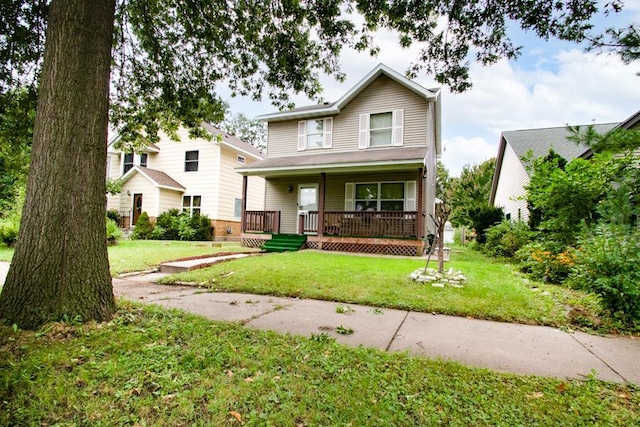 view of front facade with covered porch and a front lawn