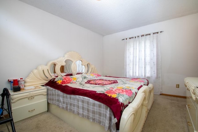 bedroom featuring light carpet