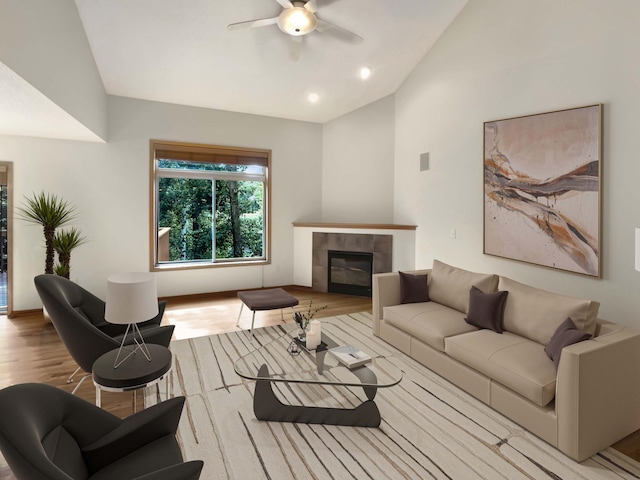 living room with ceiling fan, lofted ceiling, light wood-type flooring, and a fireplace