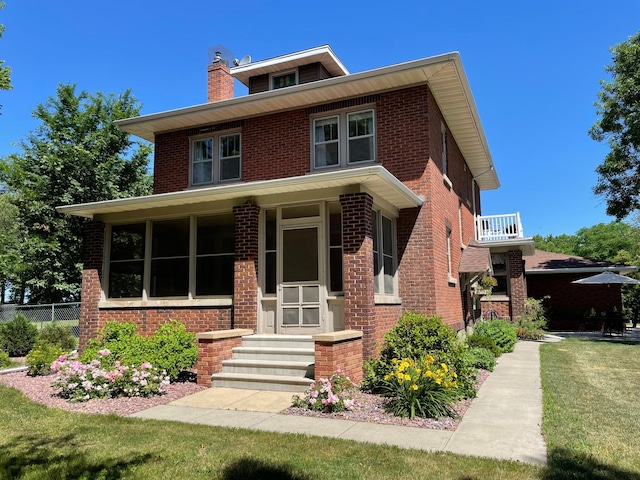 38364 200th St, Springfield, MN 56087 - american foursquare style home featuring brick siding, fence, a chimney, and a front yard