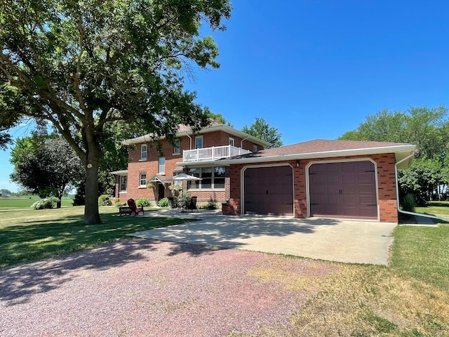 view of front of house featuring a balcony, a front lawn, and a garage