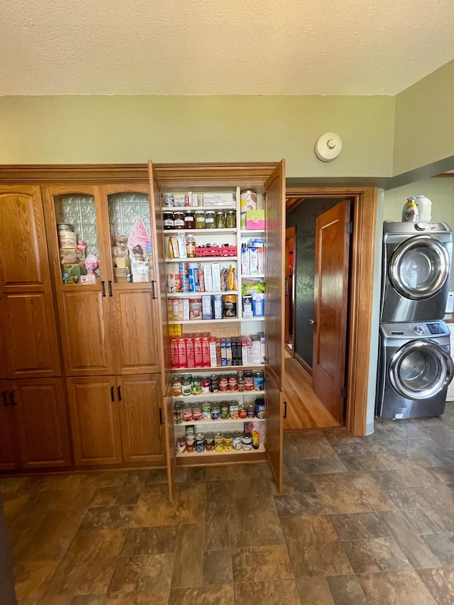 pantry with stacked washer / dryer