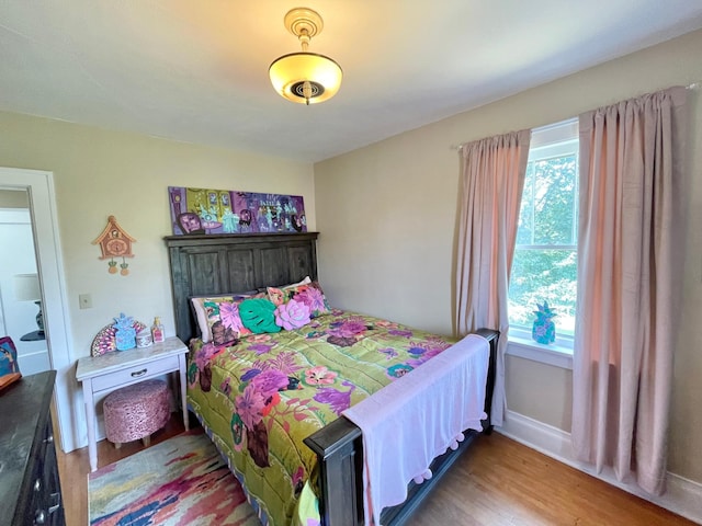 bedroom featuring hardwood / wood-style floors