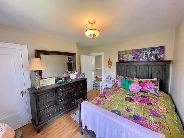 bedroom with light wood-type flooring