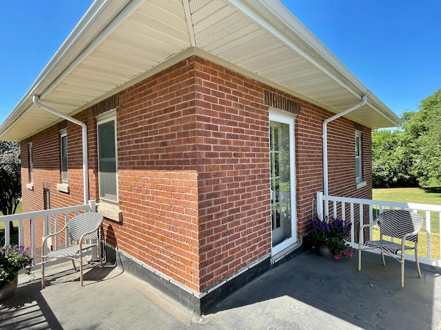 view of side of home featuring a patio area