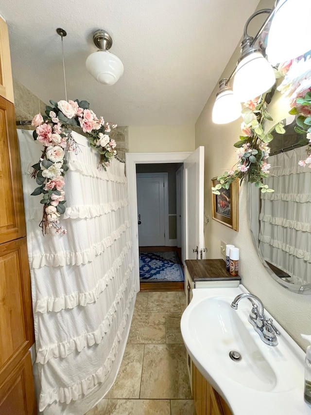 38364 200th St, Springfield, MN 56087 - bathroom featuring vanity, stone finish flooring, and curtained shower