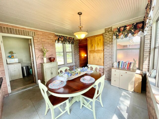 38364 200th St, Springfield, MN 56087 - dining room with brick wall and wooden ceiling