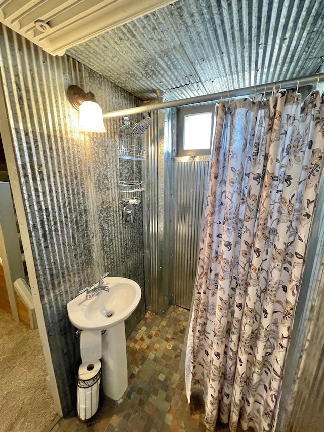 bathroom with a shower with curtain