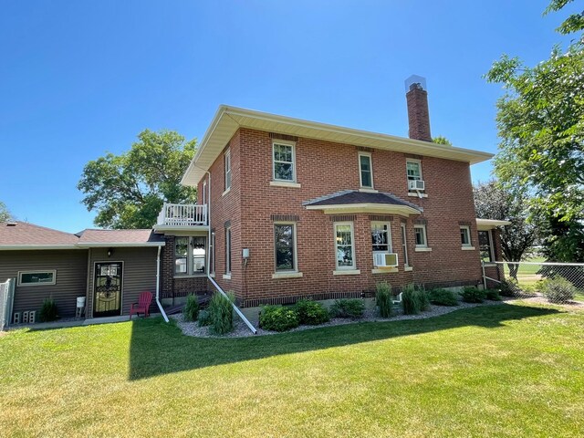 38364 200th St, Springfield, MN 56087 - back of property featuring cooling unit, a chimney, a yard, and brick siding