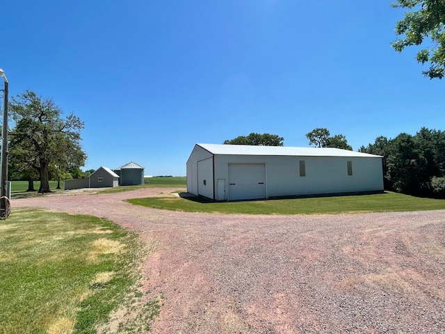 view of outdoor structure with a yard