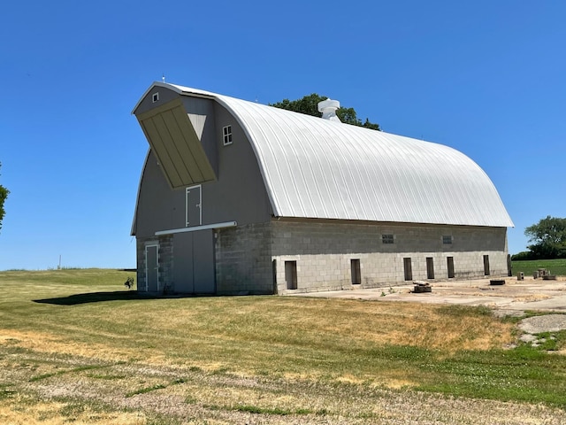 view of outbuilding with a yard