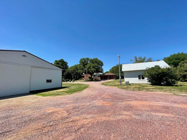 38364 200th St, Springfield, MN 56087 - exterior space with an outbuilding and dirt driveway