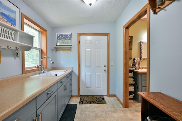 interior space featuring a textured ceiling and sink