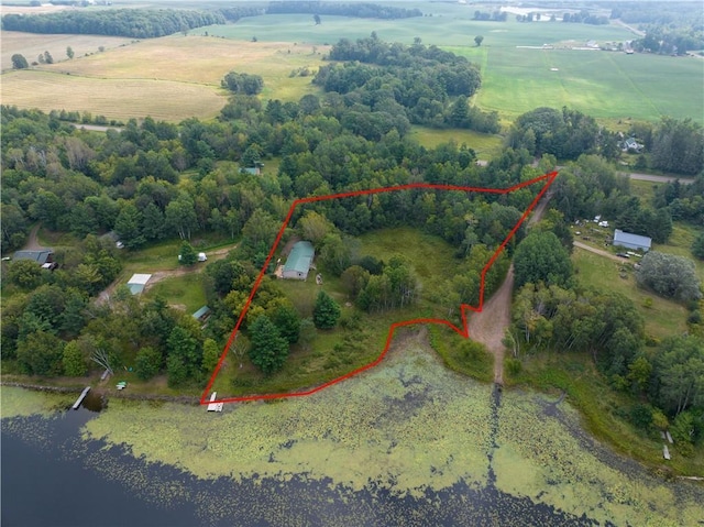 birds eye view of property with a rural view and a water view