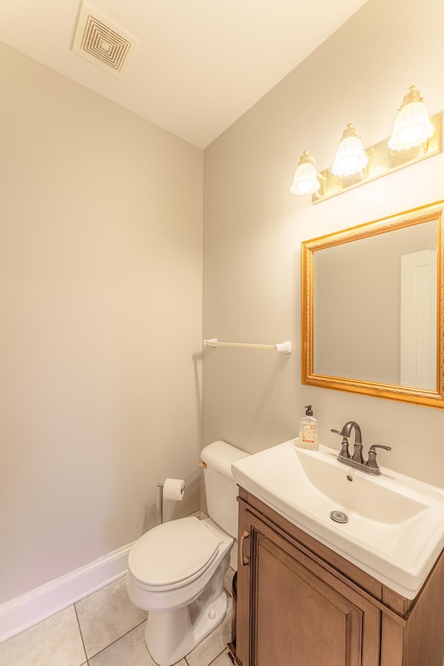 bathroom featuring visible vents, toilet, tile patterned flooring, baseboards, and vanity