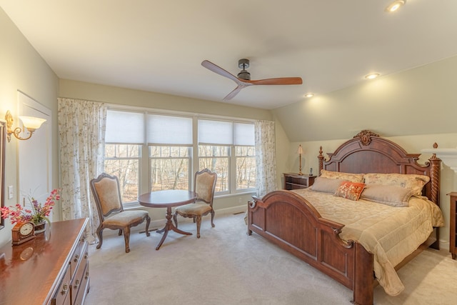 bedroom featuring light carpet, recessed lighting, baseboards, ceiling fan, and vaulted ceiling