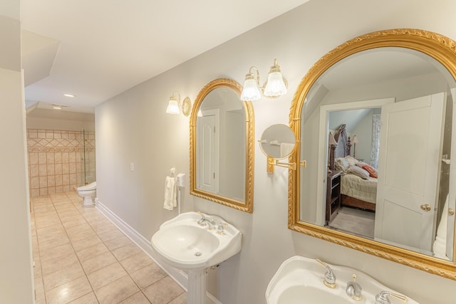 full bath with tile patterned floors, baseboards, and a sink