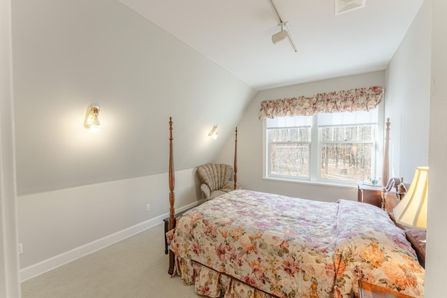 bedroom featuring vaulted ceiling, carpet flooring, baseboards, and visible vents