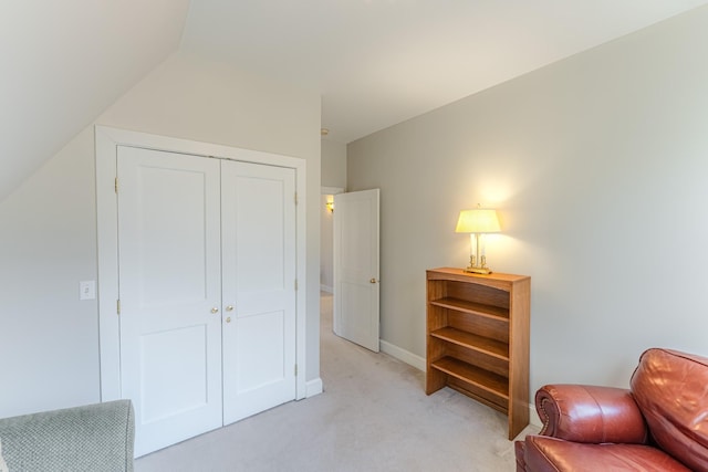 sitting room featuring light carpet and baseboards