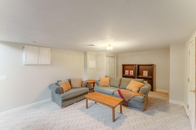 living area featuring light carpet and baseboards