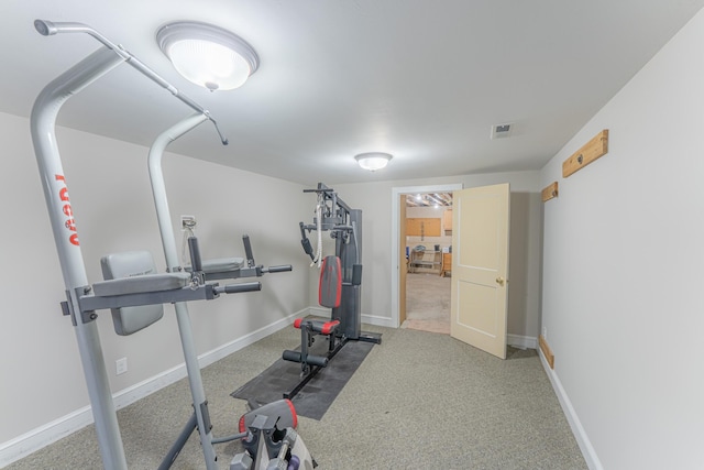 workout room with visible vents and baseboards