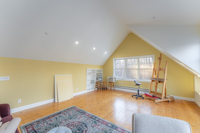 game room featuring hardwood / wood-style flooring, built in shelves, baseboards, and lofted ceiling