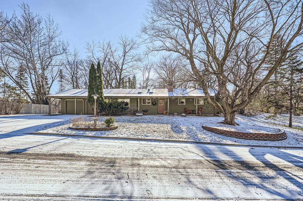 ranch-style home featuring a garage