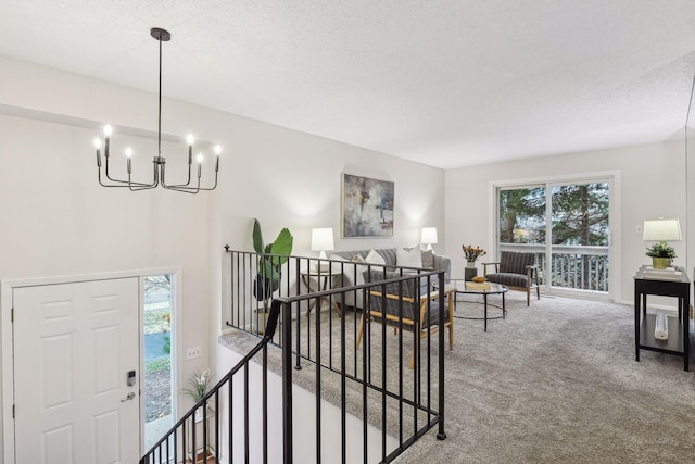 carpeted living room with a chandelier and a wealth of natural light