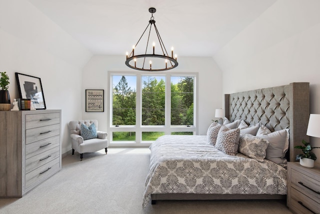 carpeted bedroom with lofted ceiling and a notable chandelier