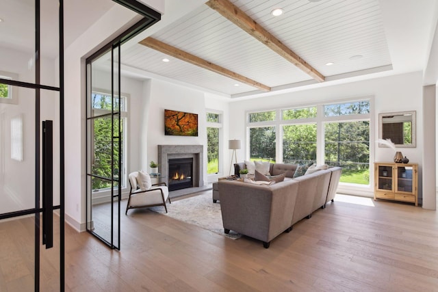 living room with wooden ceiling, beamed ceiling, and hardwood / wood-style floors