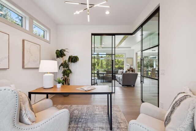 interior space with an inviting chandelier and wood-type flooring