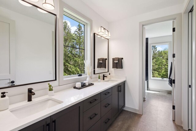 bathroom featuring vanity, plenty of natural light, and tile patterned flooring