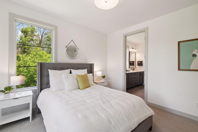 carpeted bedroom with ensuite bathroom