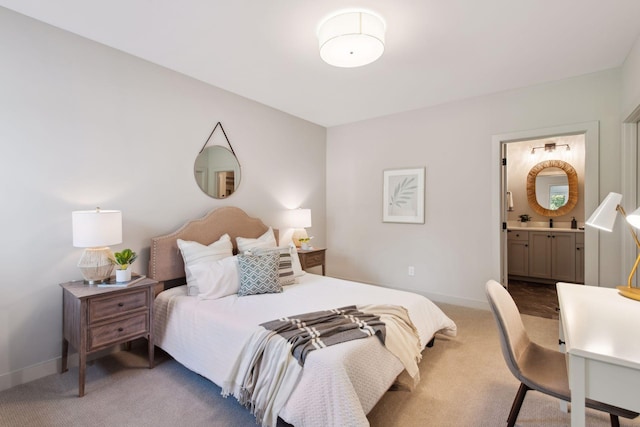 carpeted bedroom featuring ensuite bathroom