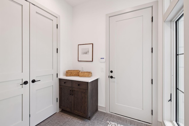 bathroom with tile patterned floors and vanity