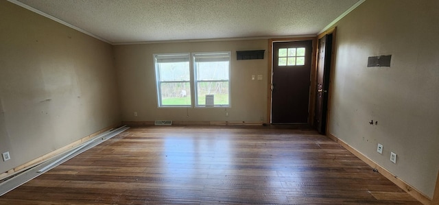 entrance foyer featuring a textured ceiling, dark wood-type flooring, visible vents, and crown molding