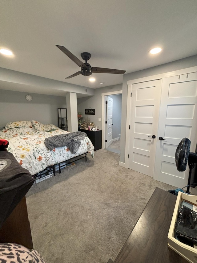 carpeted bedroom with recessed lighting, ceiling fan, and a closet