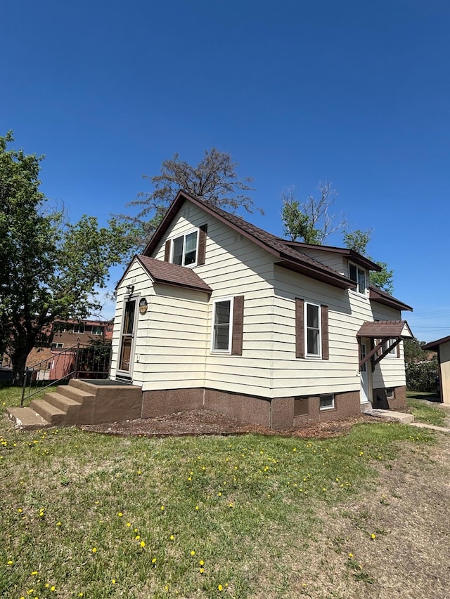 608 Granger Rd, Detroit Lakes, MN 56501 - view of side of home featuring a yard