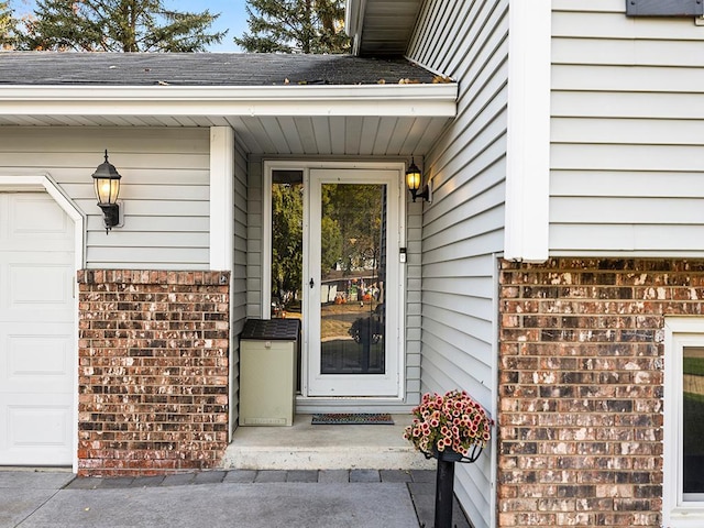 property entrance with a garage