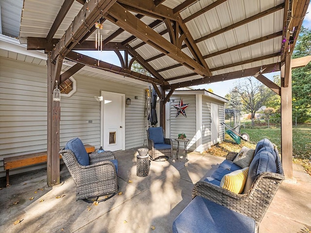 view of patio / terrace with a gazebo and a storage unit