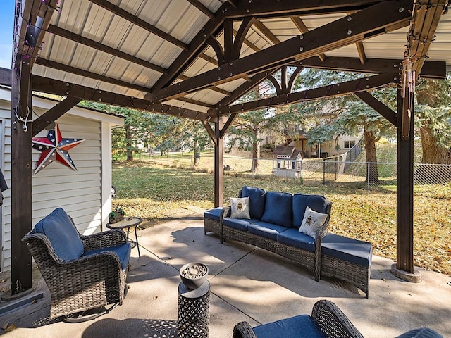 view of patio / terrace featuring a gazebo and a storage shed