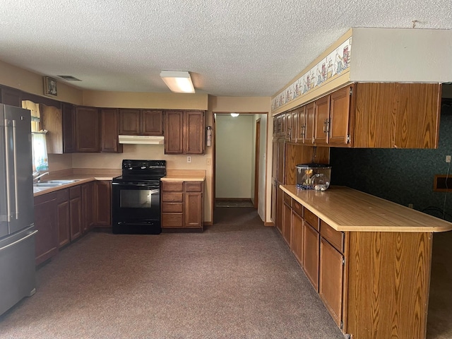 kitchen featuring sink, dark colored carpet, electric range, high end fridge, and a textured ceiling