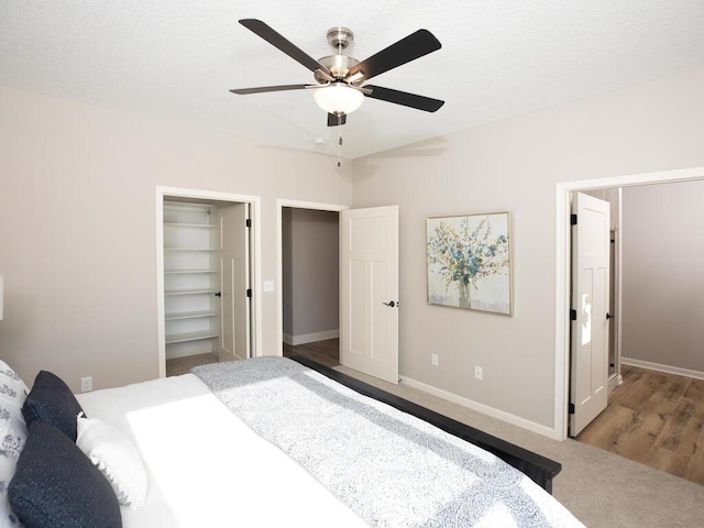 bedroom featuring light wood-type flooring, a closet, and ceiling fan