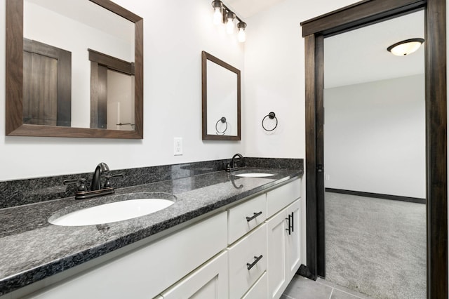 bathroom featuring dual vanity and tile patterned floors