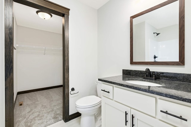 bathroom with toilet and vanity