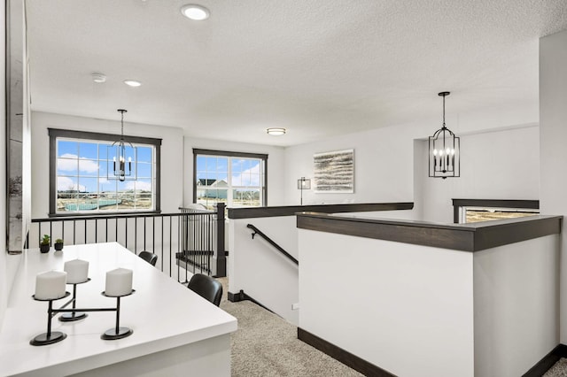 1105 136th St E, Rosemount, MN 55068 - kitchen with a chandelier, carpet flooring, decorative light fixtures, recessed lighting, and a textured ceiling